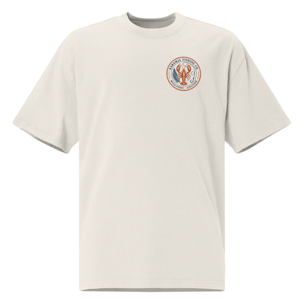 Karamja Fishing Co. crest on the chest of a faded bone tee